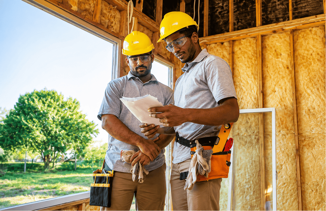 AtticPro team reviewing an insulation plan on site