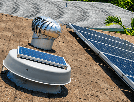 Solar attic fan on a roof