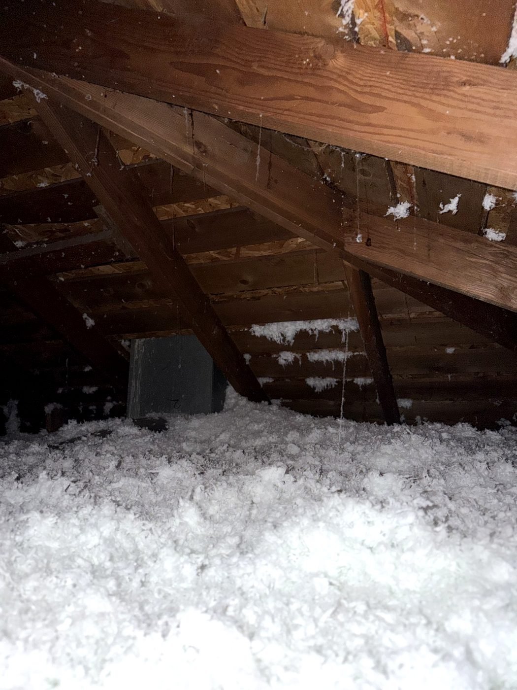 Attic floor covered in a deep, even blanket of new blown-in insulation