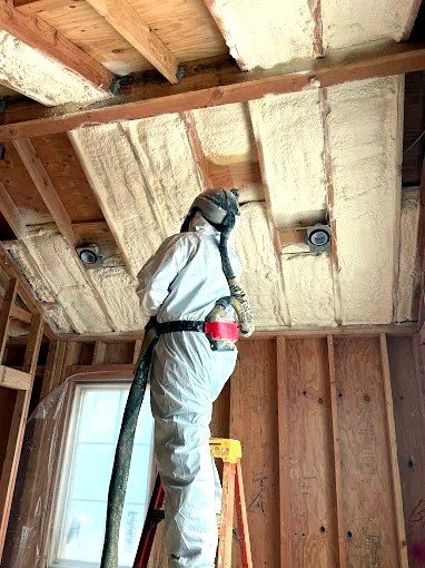 Crew air sealing an attic in Denver