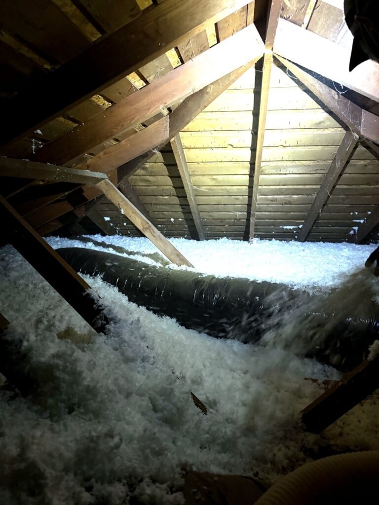 Even blown-in insulation coverage across an attic floor in the Denver metro