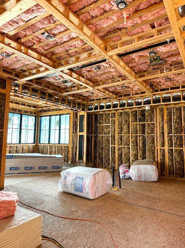 Bright, fully insulated finished attic space after AtticPro installation in Denver